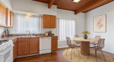 a kitchen with wooden cabinets