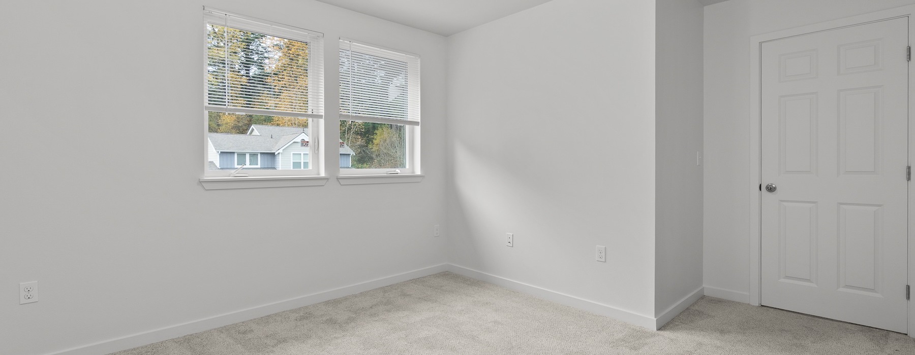 a room with carpet and a window