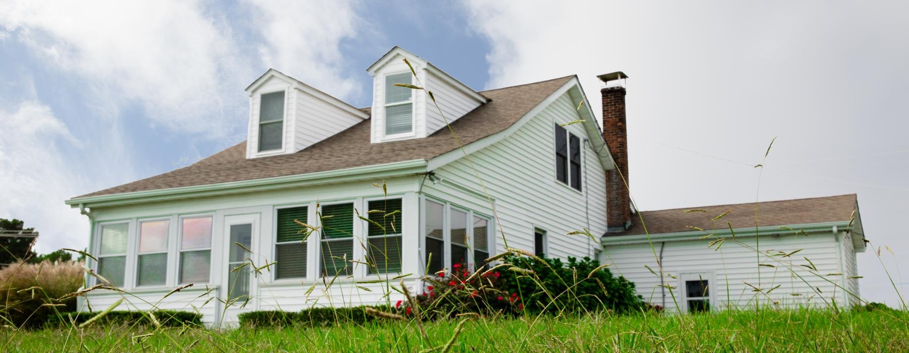 a white house with a red roof