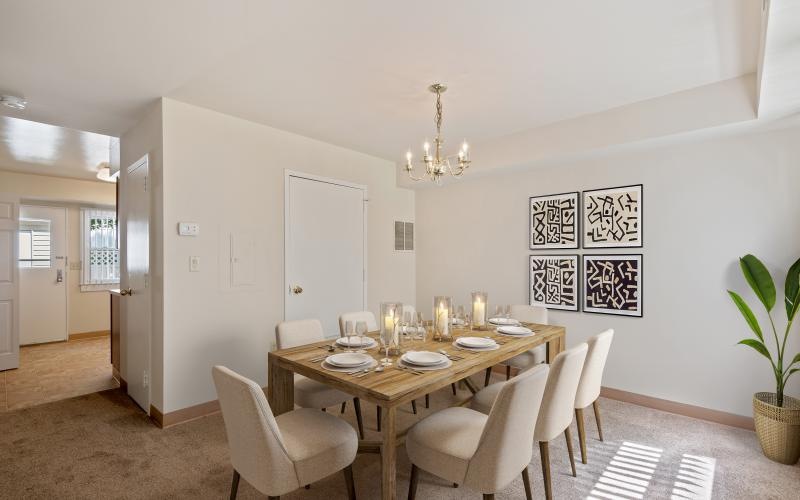 a dining room with a table and chairs