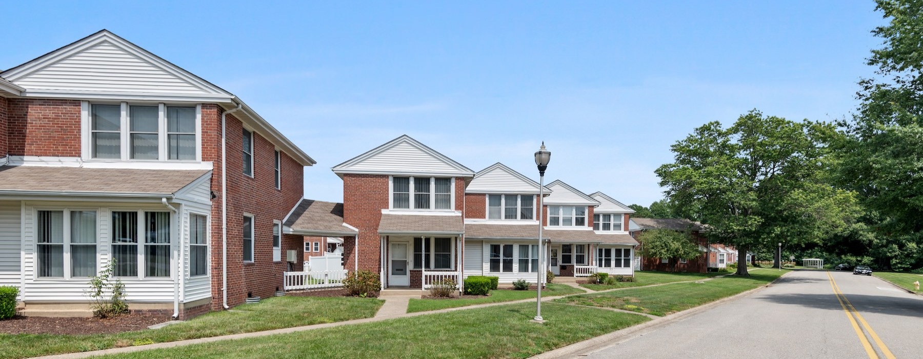 a row of brick homes near a street