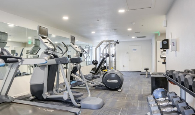 a room with treadmills and treadmills