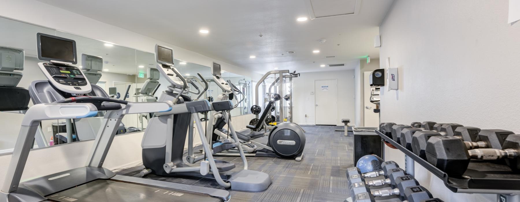 a room with treadmills and treadmills
