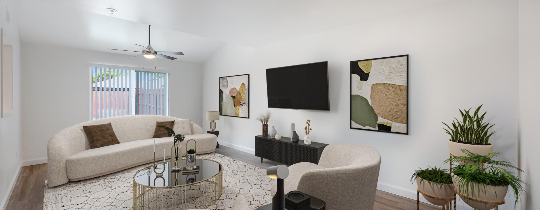 a living room with a tv and couches