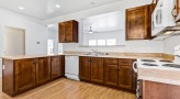 a kitchen with wooden cabinets