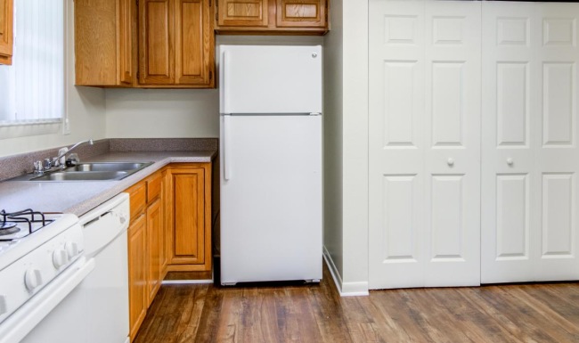 a kitchen with white cabinets
