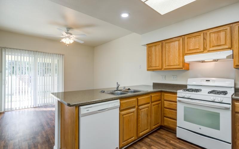 a kitchen with wooden cabinets
