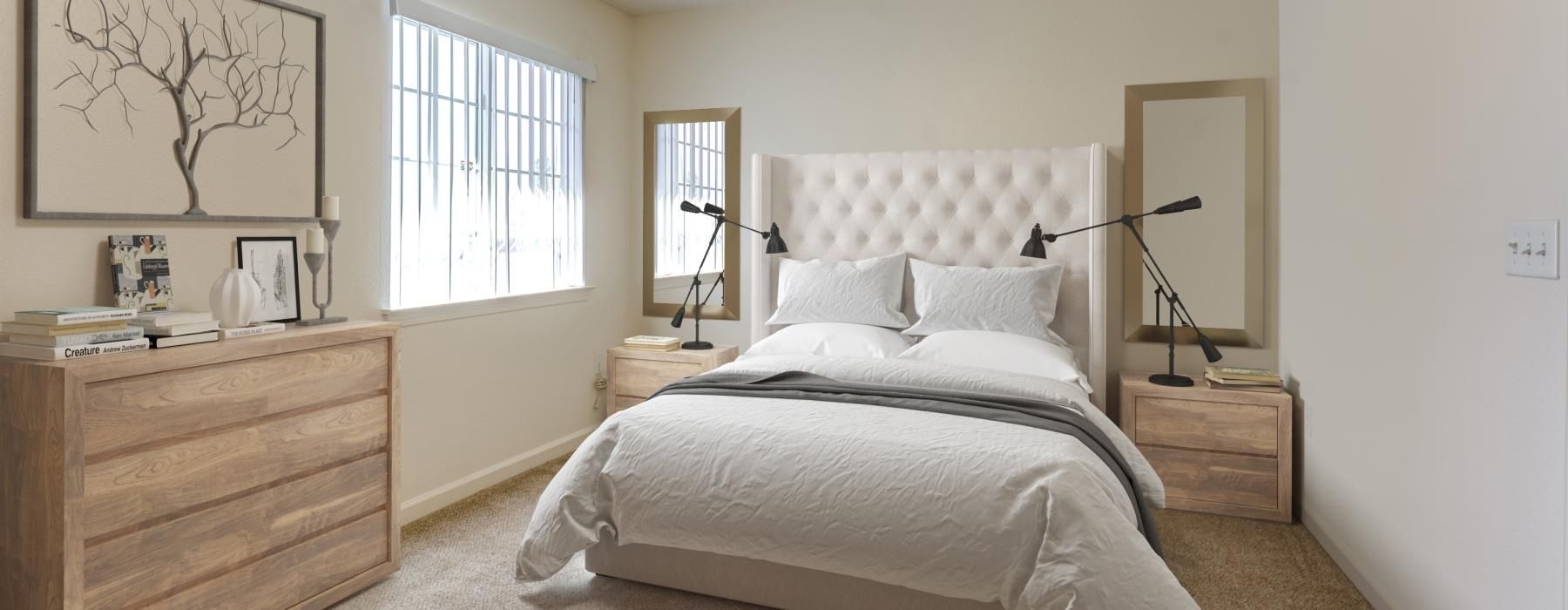 a bedroom with a bed and a ceiling fan