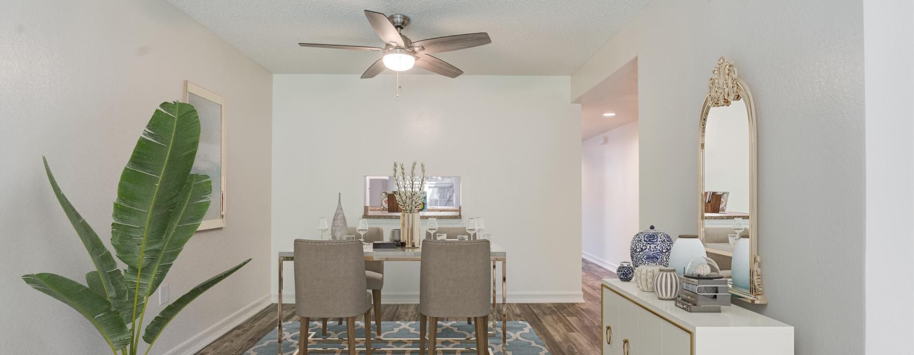 a dining room with a fan