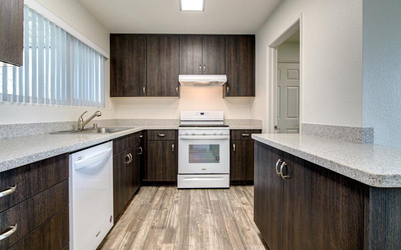 a kitchen with wooden cabinets