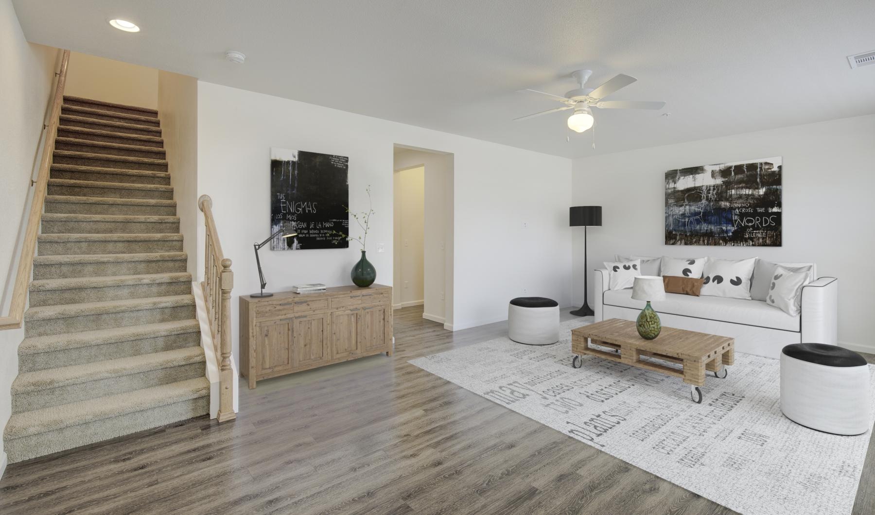 a living room with a staircase