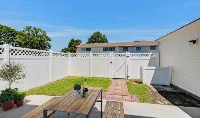 backyard with tall fence
