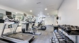 a room with treadmills and treadmills
