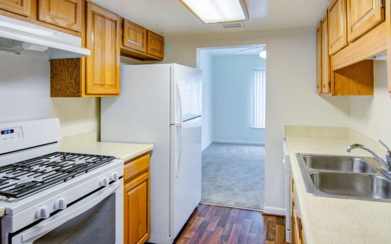 a kitchen with white appliances