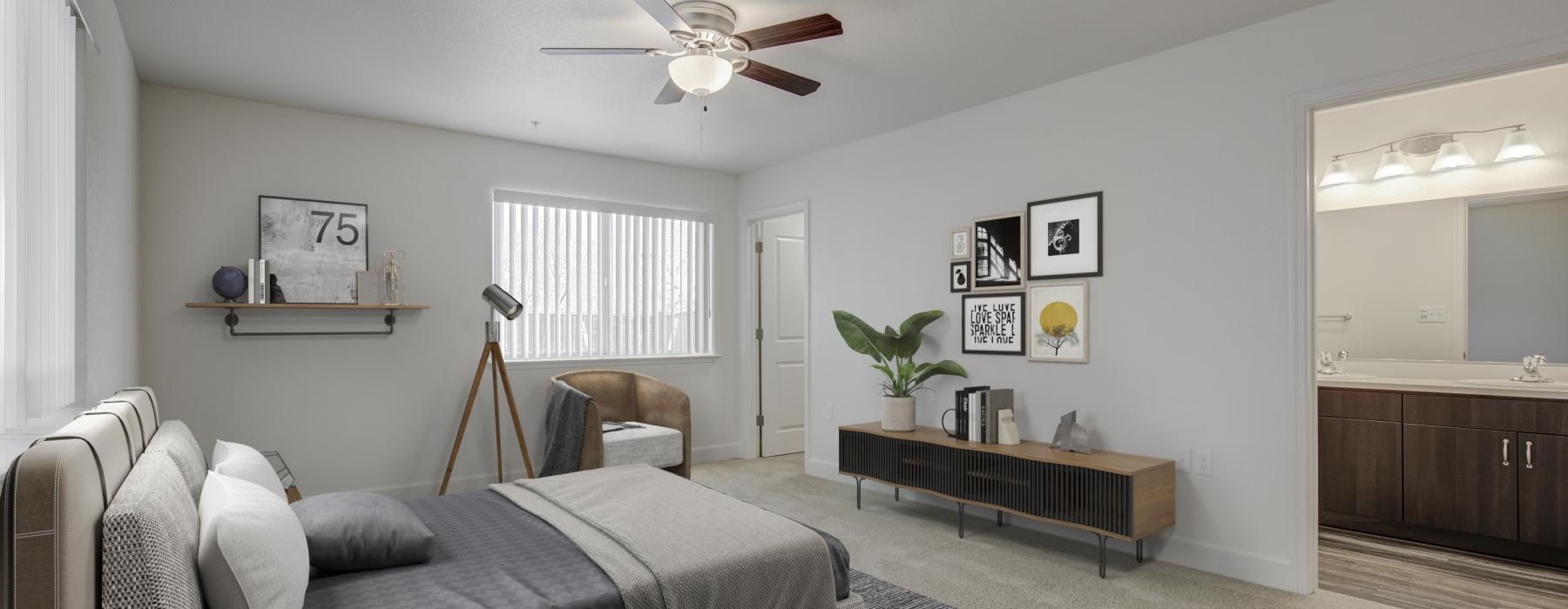 a bedroom with a bed and a fan