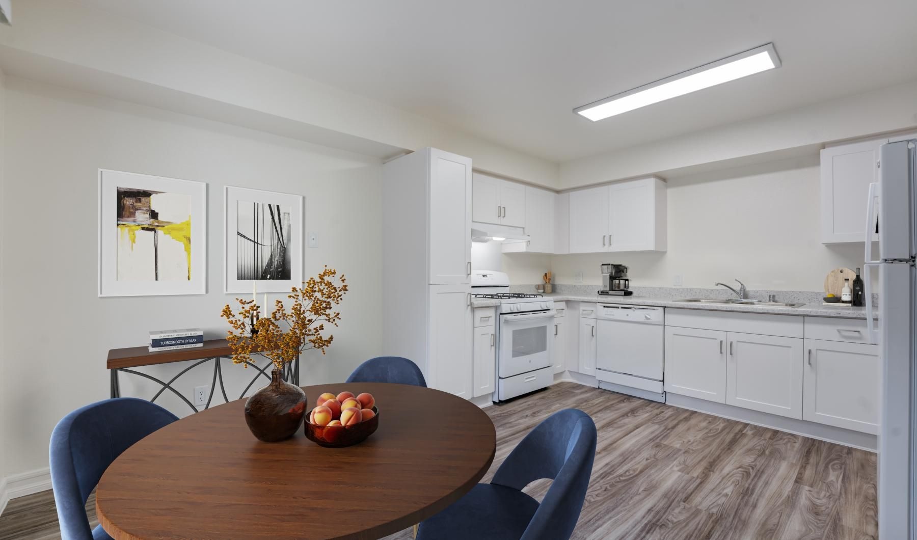 a kitchen with a table and chairs