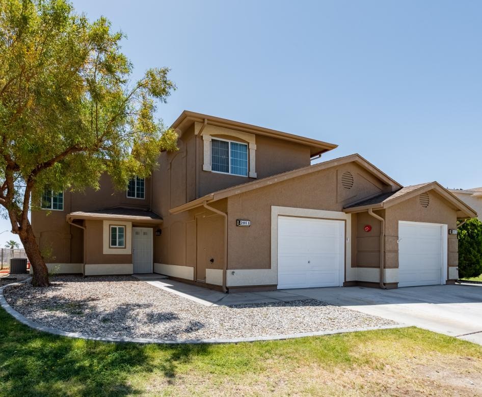 a house with a tree in the front