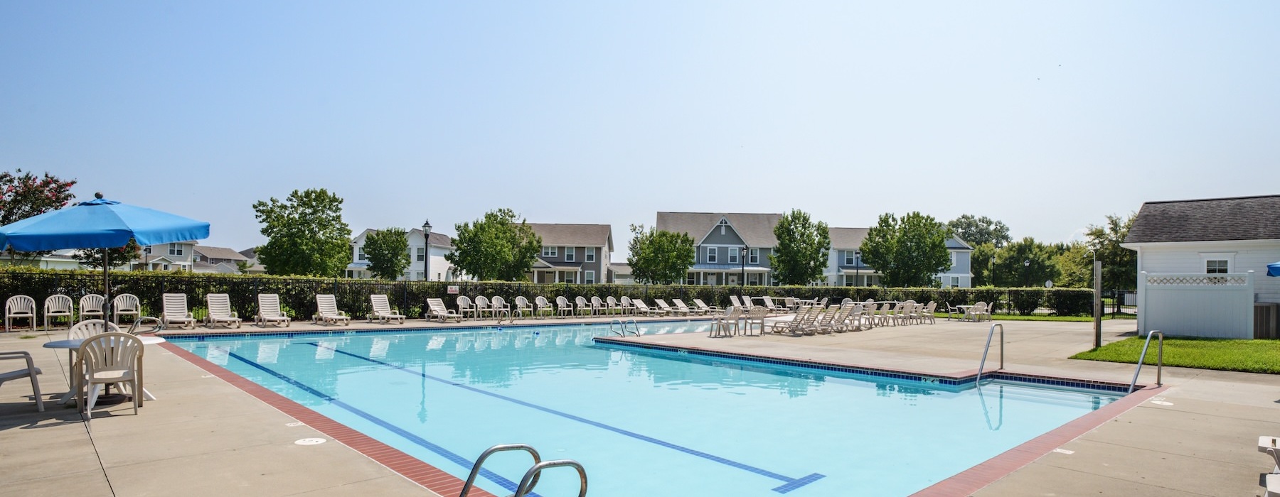 swimming pool with lounge chairs