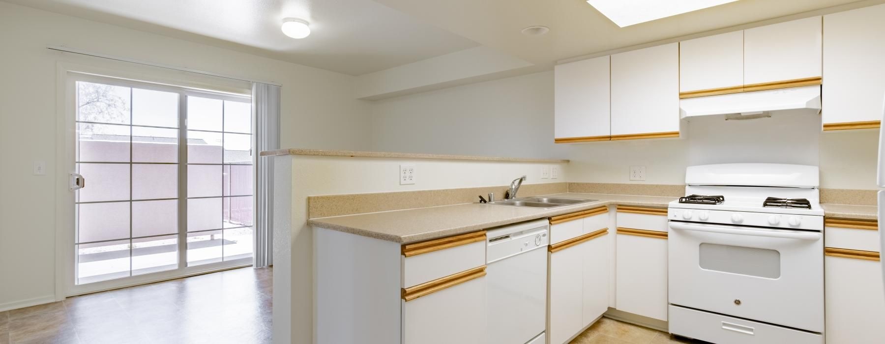 a kitchen with white cabinets