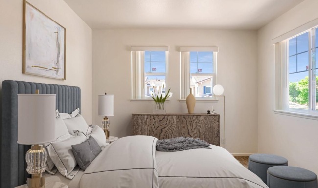 a bedroom with a bed and a tv