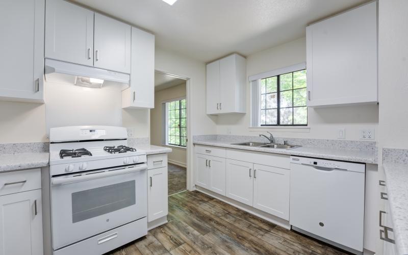 a kitchen with white cabinets