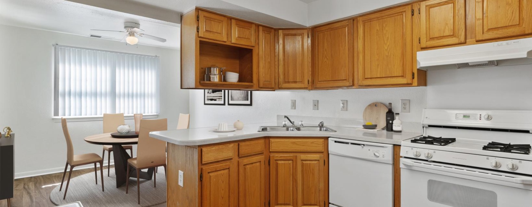 a kitchen with wooden cabinets
