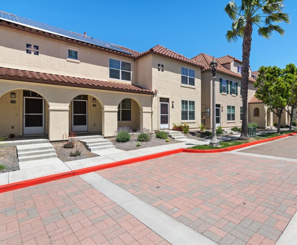 a brick walkway leading to a building