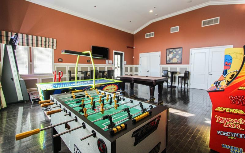 a room with a pool table and a pool table