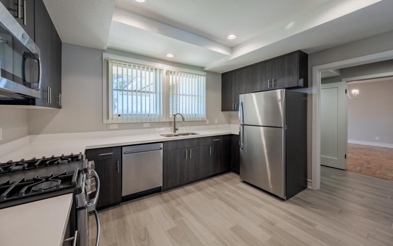 a kitchen with black appliances