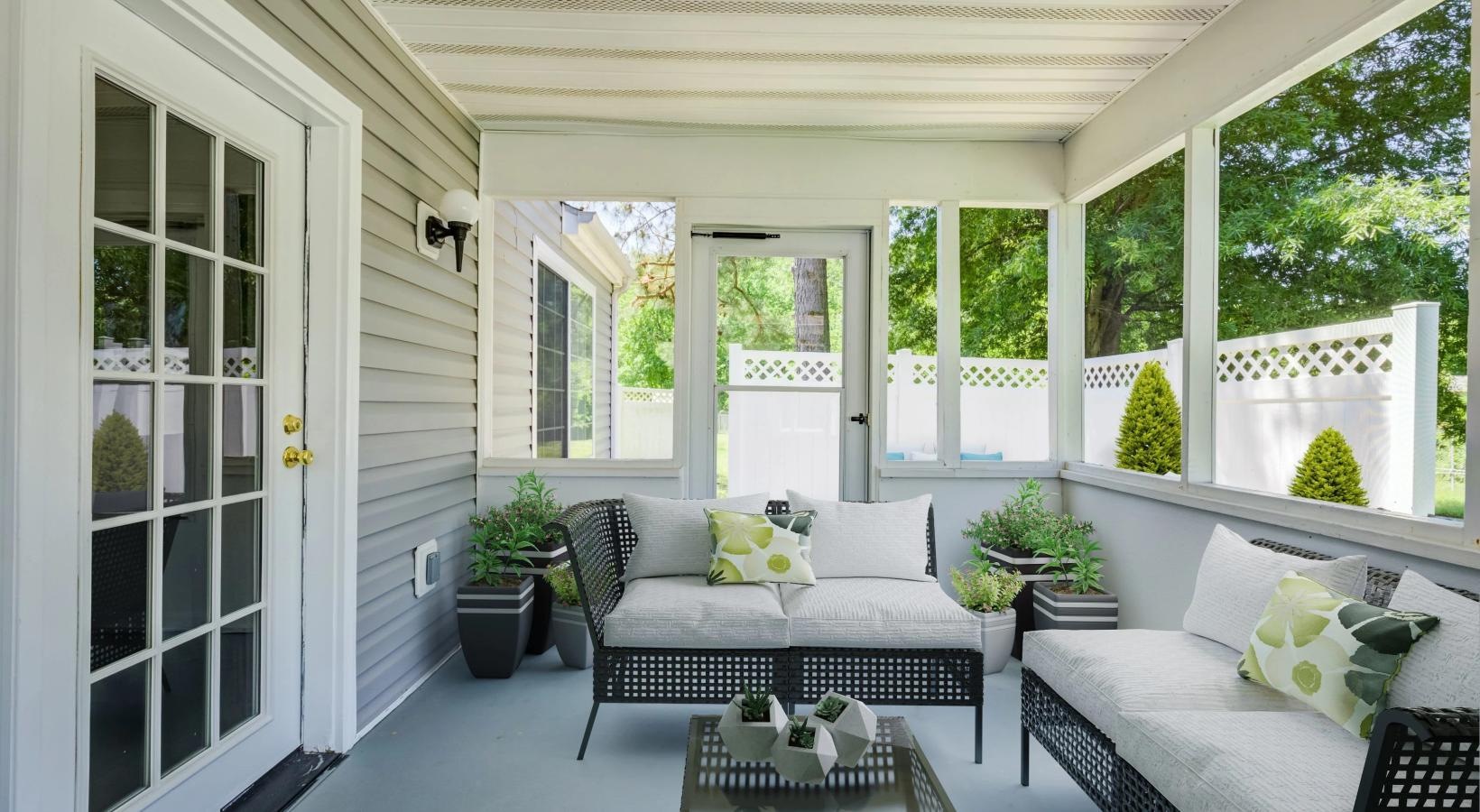 a patio with seating and a table