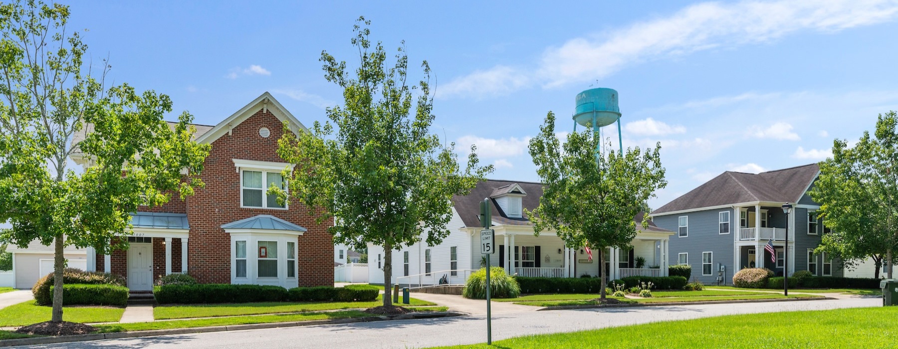a row of houses with lawns