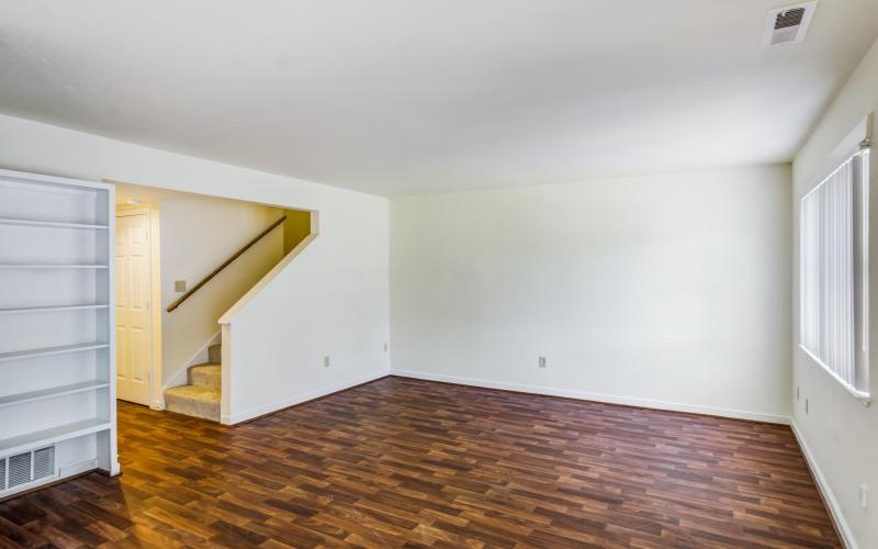 a room with a wood floor and a wood floor