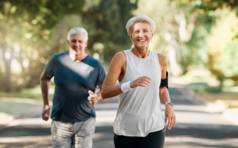 a man and woman running