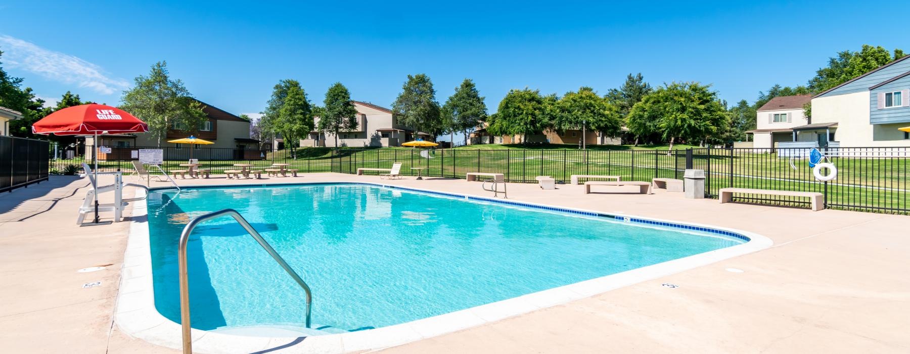 a swimming pool with a fence around it