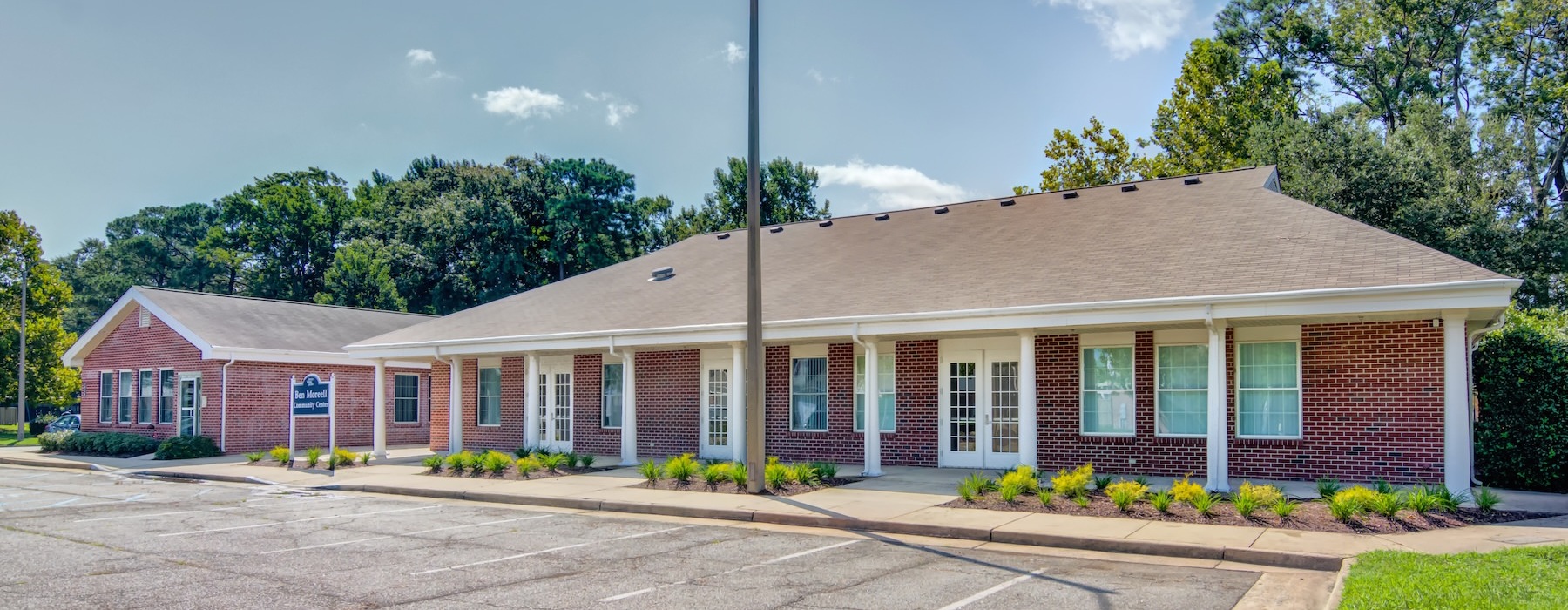a parking lot with a brick building