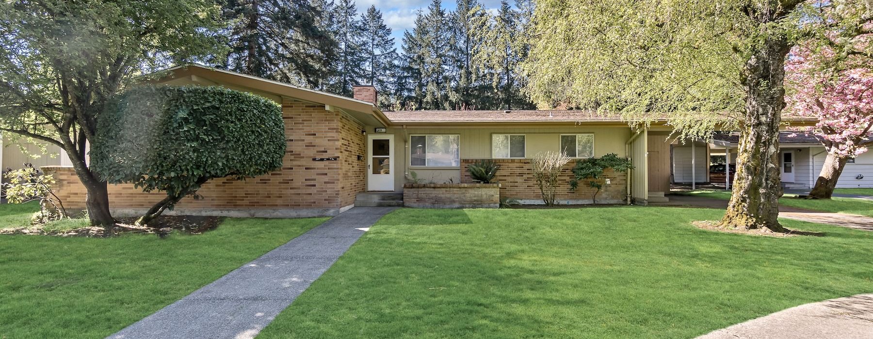 a home with trees and front yard