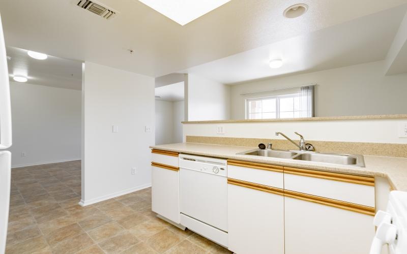 a kitchen with white cabinets