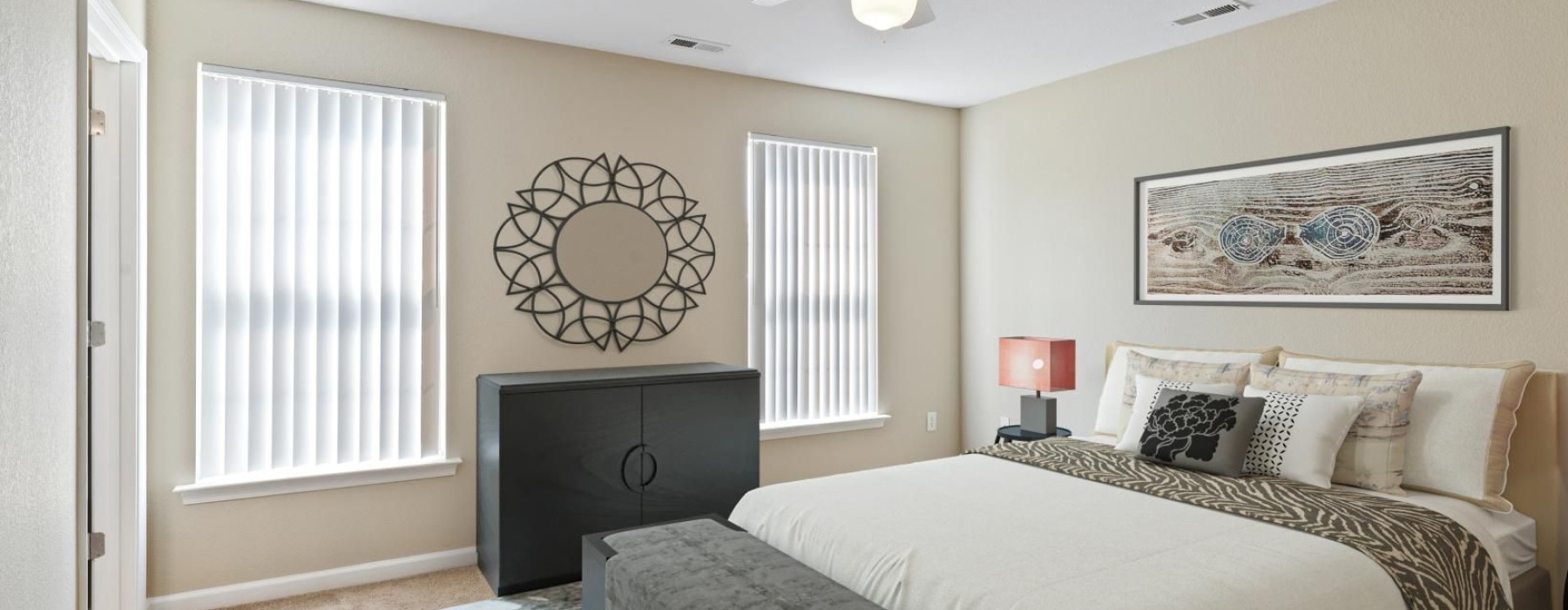 a bedroom with a bed and a fan