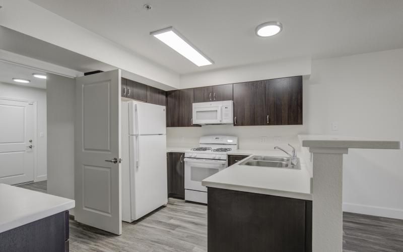 a kitchen with white cabinets