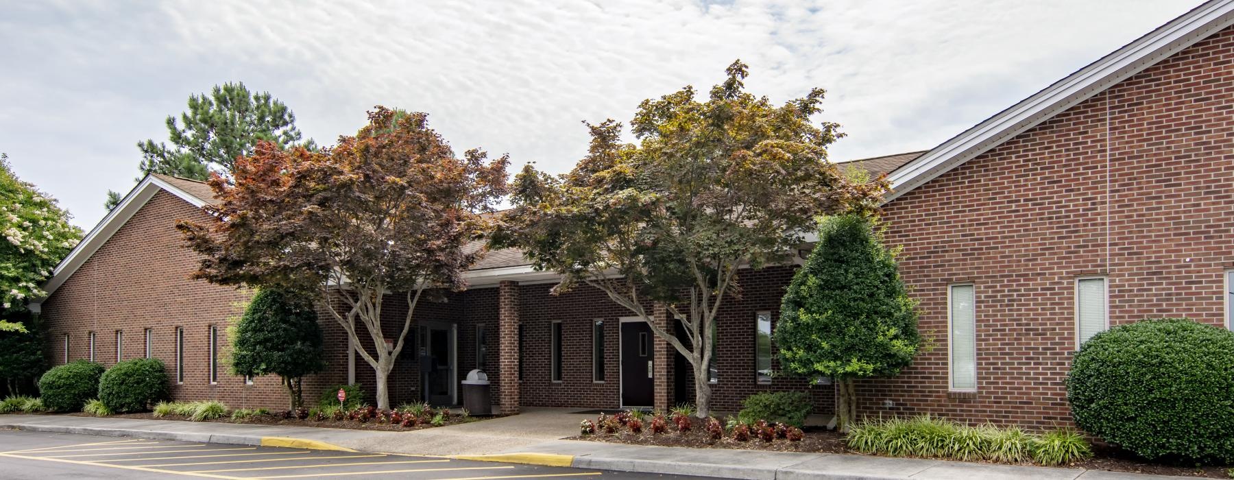 red brick building and parking lot at Fairway Crescent