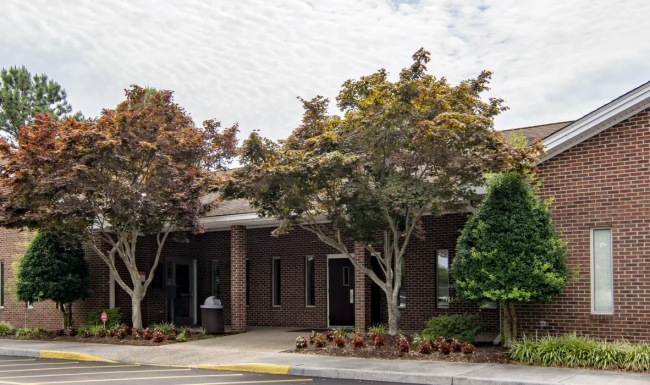 red brick building and parking lot at Fairway Crescent