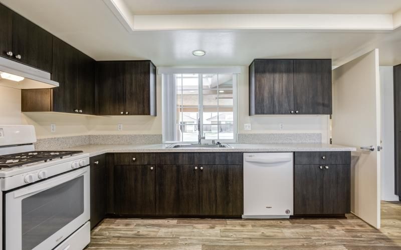 a kitchen with black cabinets