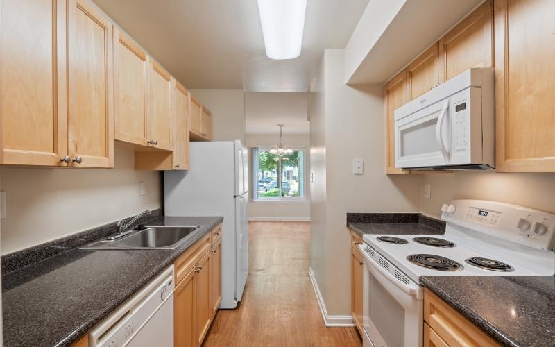 a kitchen with wooden cabinets