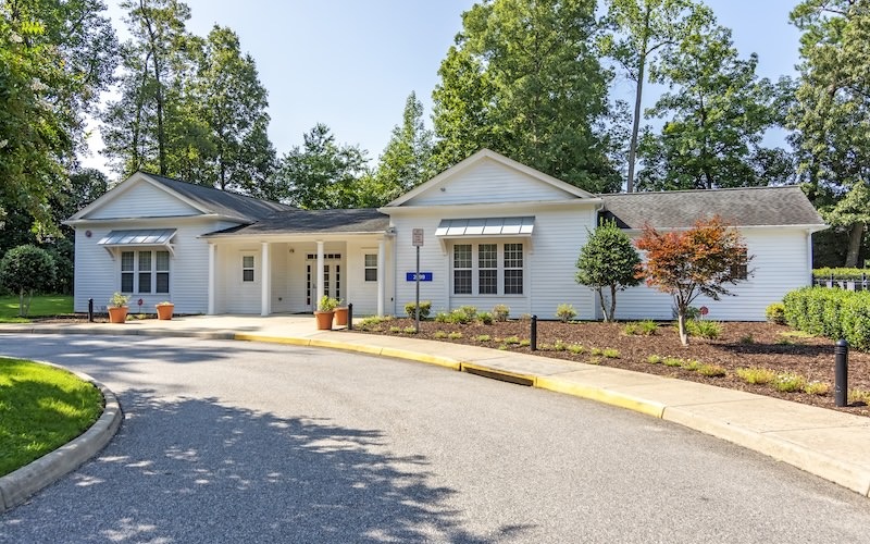 exterior of a white community center building