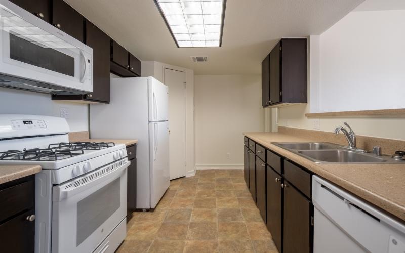 a kitchen with white appliances