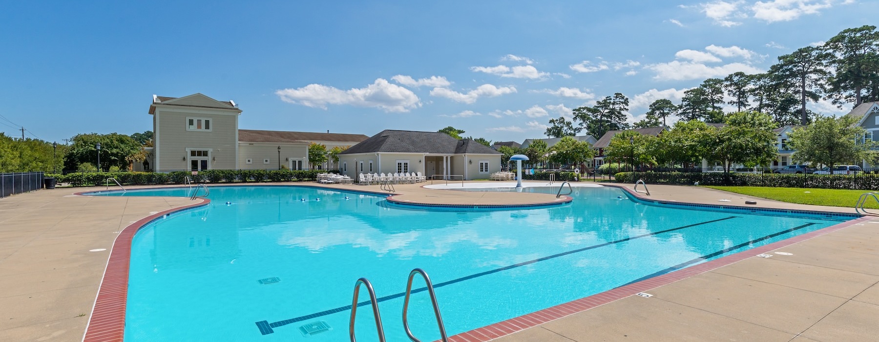 swimming pool with lounge chairs