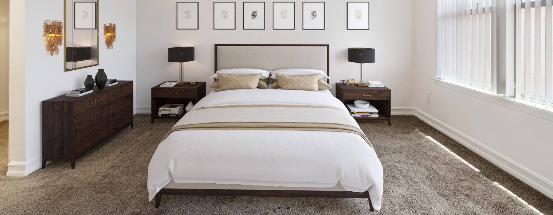 bright, carpeted bedroom with large windows