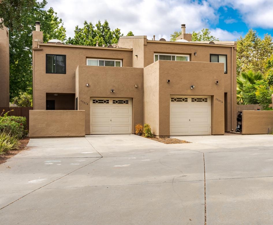 a building with garages and trees