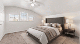 bedroom with custom shaped ceilings