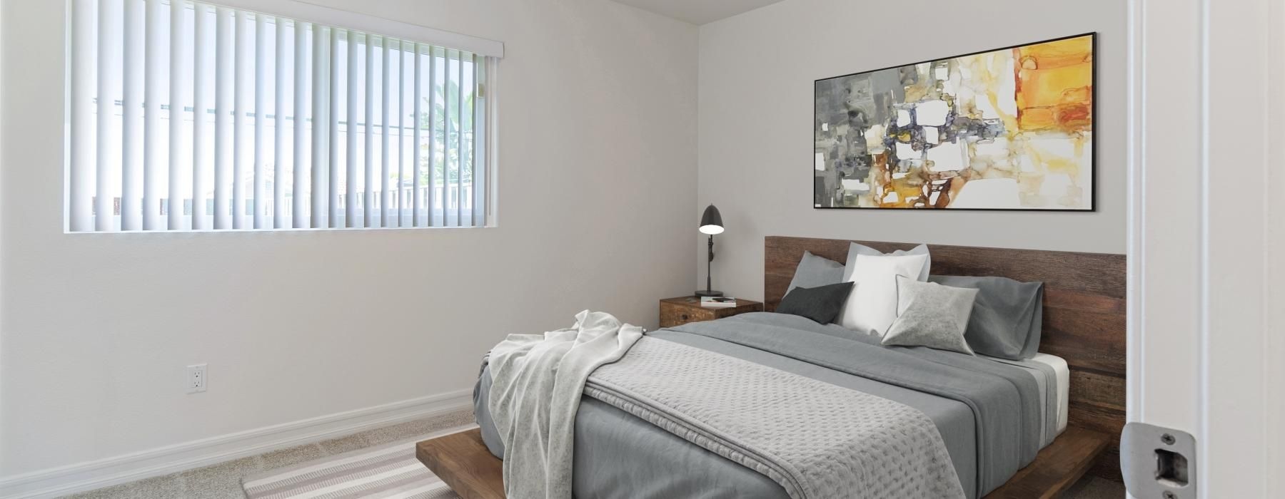 a bedroom with a bed and a fan